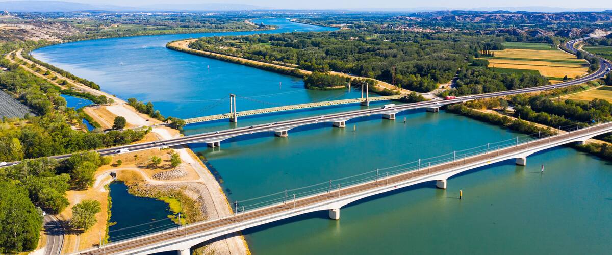 A river with a bridge and a highway.