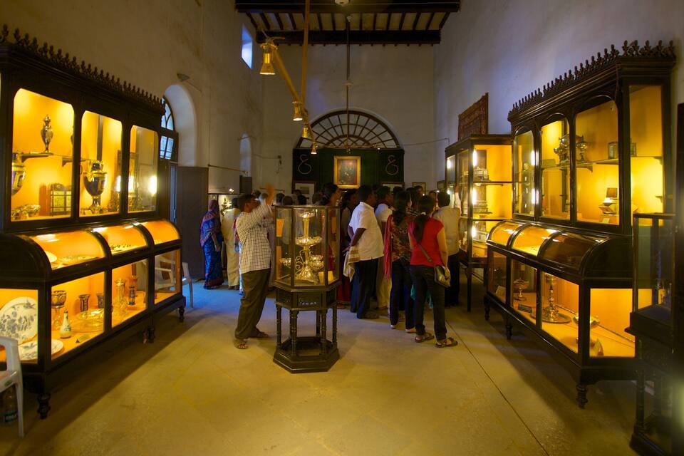A museum with glass display cases containing various artifacts.