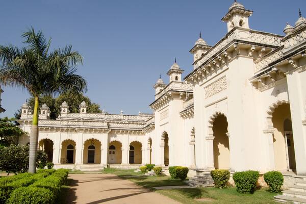 A historic building with arched doorways and a central courtyard.