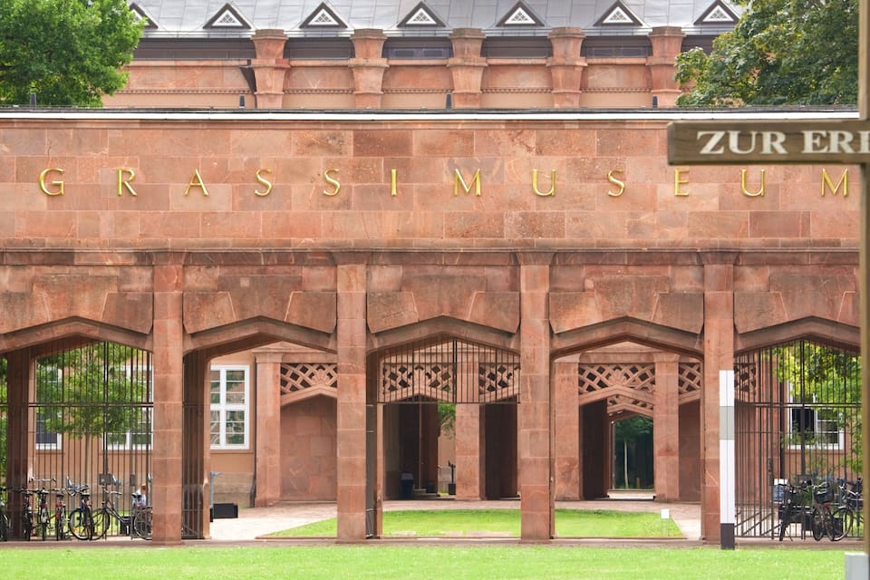The exterior of the Grassimuseum with its stone facade and arched entrances.