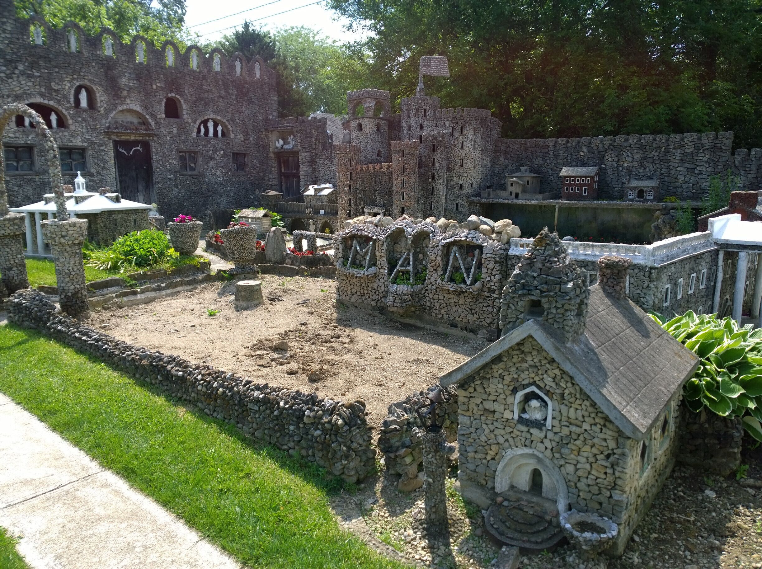 The Hartman Rock Garden is most definitely a unique roadside attraction. 

What started in 1932 by Ben Hartman as a concrete fishing pond, expanded into an entire mini world using thousands of stones, a myriad of plants, handmade figurines and one hell of an imagination.

After Ben's passing in 1944, his widow, Mary took over his labor of love until her passing in 1997.

The garden began to succumb to neglect but was renovated in 2009 and is now open and free for visitors every day. 