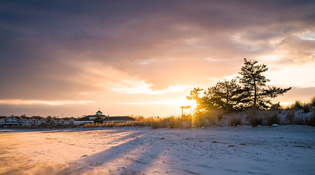 Vibrant sunset through clouds at Narragansett Town Beach