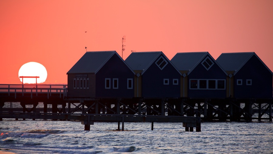 Busselton Jetty which includes a sunset and general coastal views