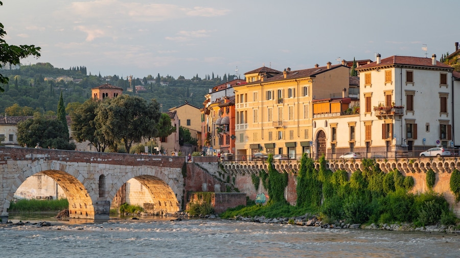 Adige River showing a bridge, a sunset and a river or creek