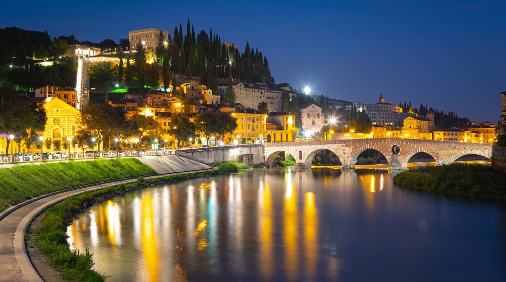 Adige River showing a river or creek, a bridge and night scenes