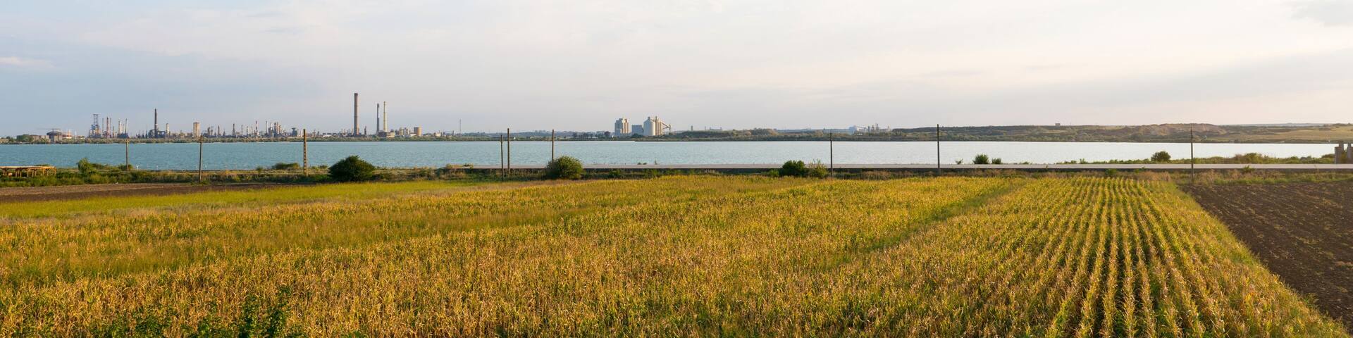 Constanta, Romania - August 16, 2019: Panoramic view of Lake Corbu with Navodari Petromidia Refinery in the background.
