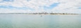 Panoramic view of Praia do Bessa beach and the city of Joao Pessoa. Seafront buildings, some tourists riding kayak and stand up paddle.