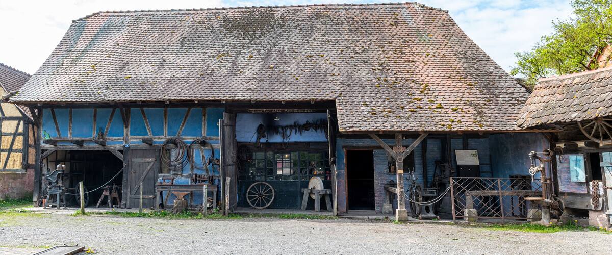 A traditional building with a tiled roof and wooden beams.