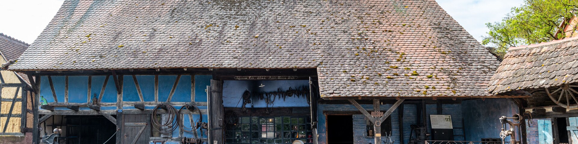 A traditional building with a tiled roof and wooden beams.