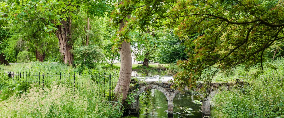 Morden, London, England, United Kingdom - 9 June 2015: Small old arched bridge in Morden reerw, London UK