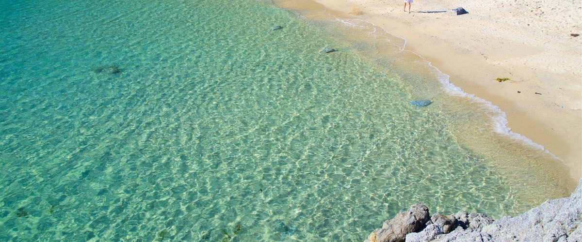 Grotticelle Beach which includes general coastal views, a sandy beach and tropical scenes