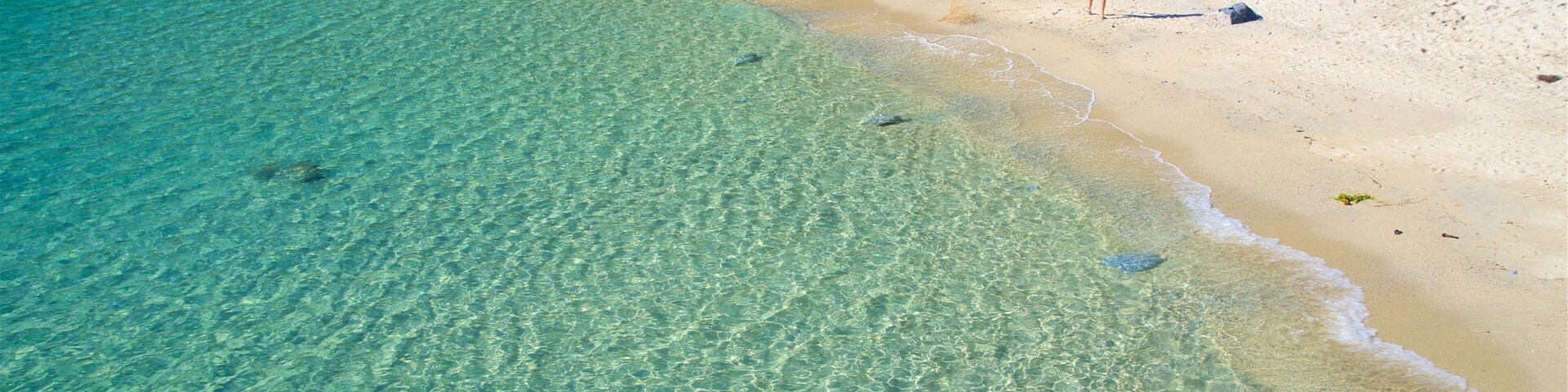 Grotticelle Beach which includes general coastal views, a sandy beach and tropical scenes