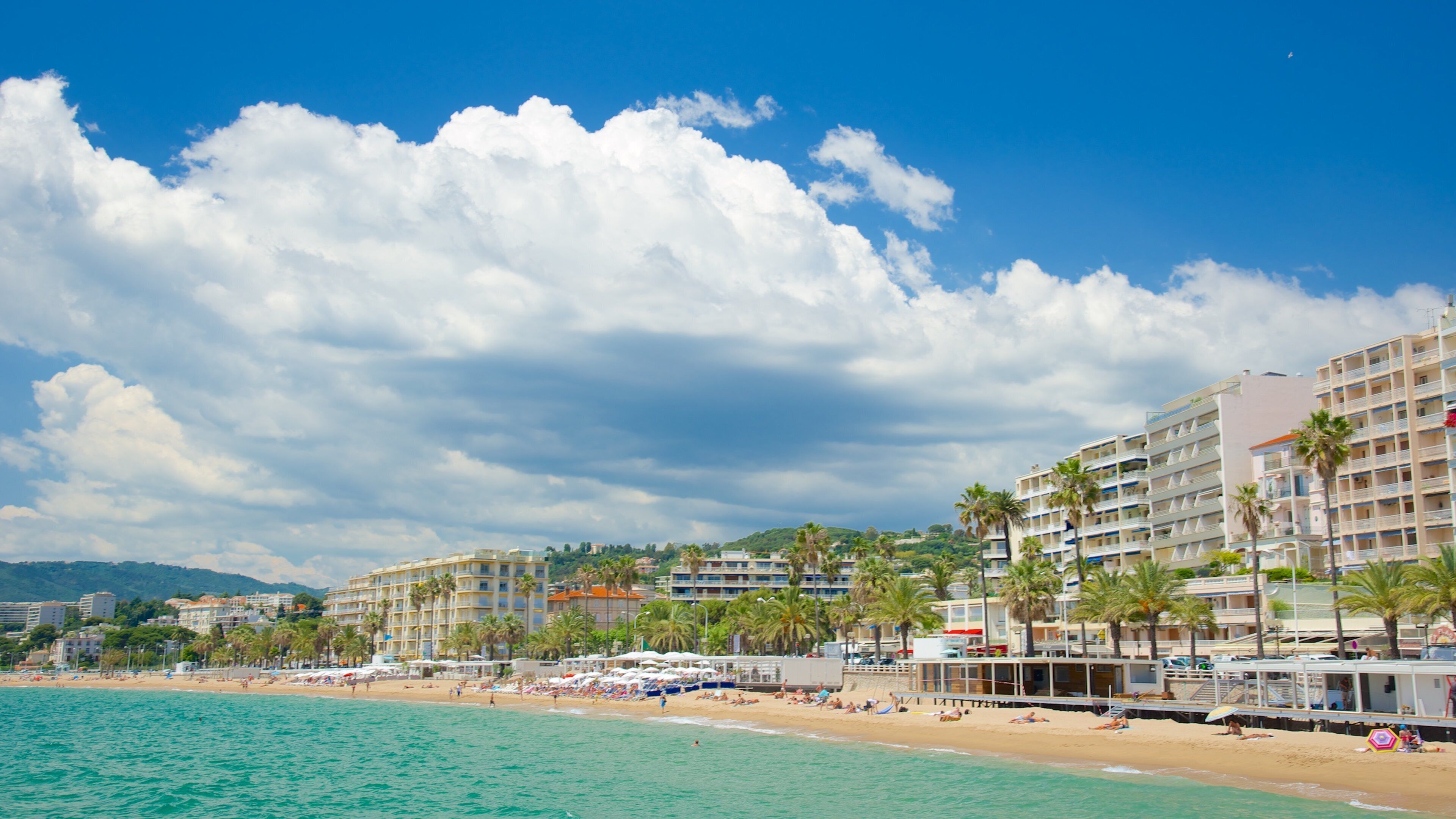 Midi Beach featuring a coastal town and a sandy beach