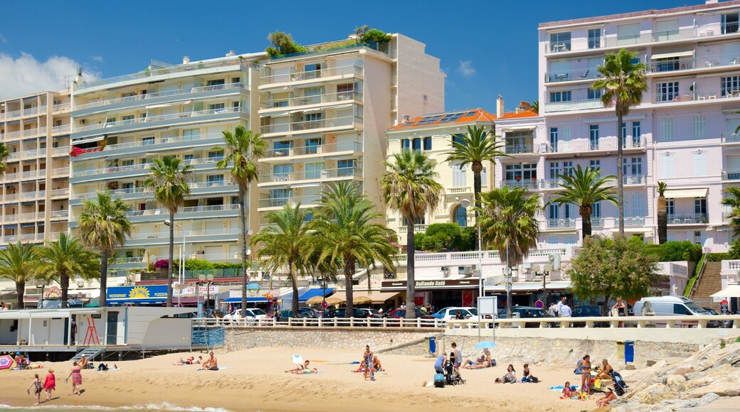 Midi Beach which includes a sandy beach and a coastal town