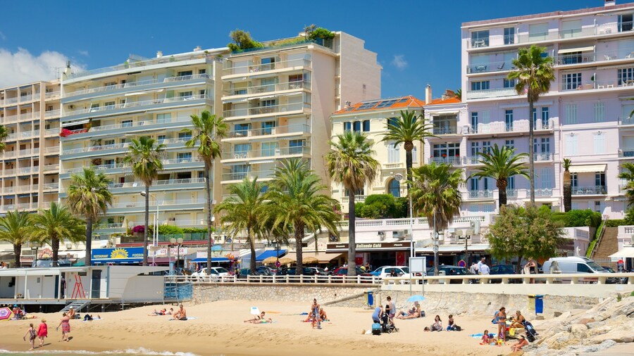 Midi Beach which includes a sandy beach and a coastal town