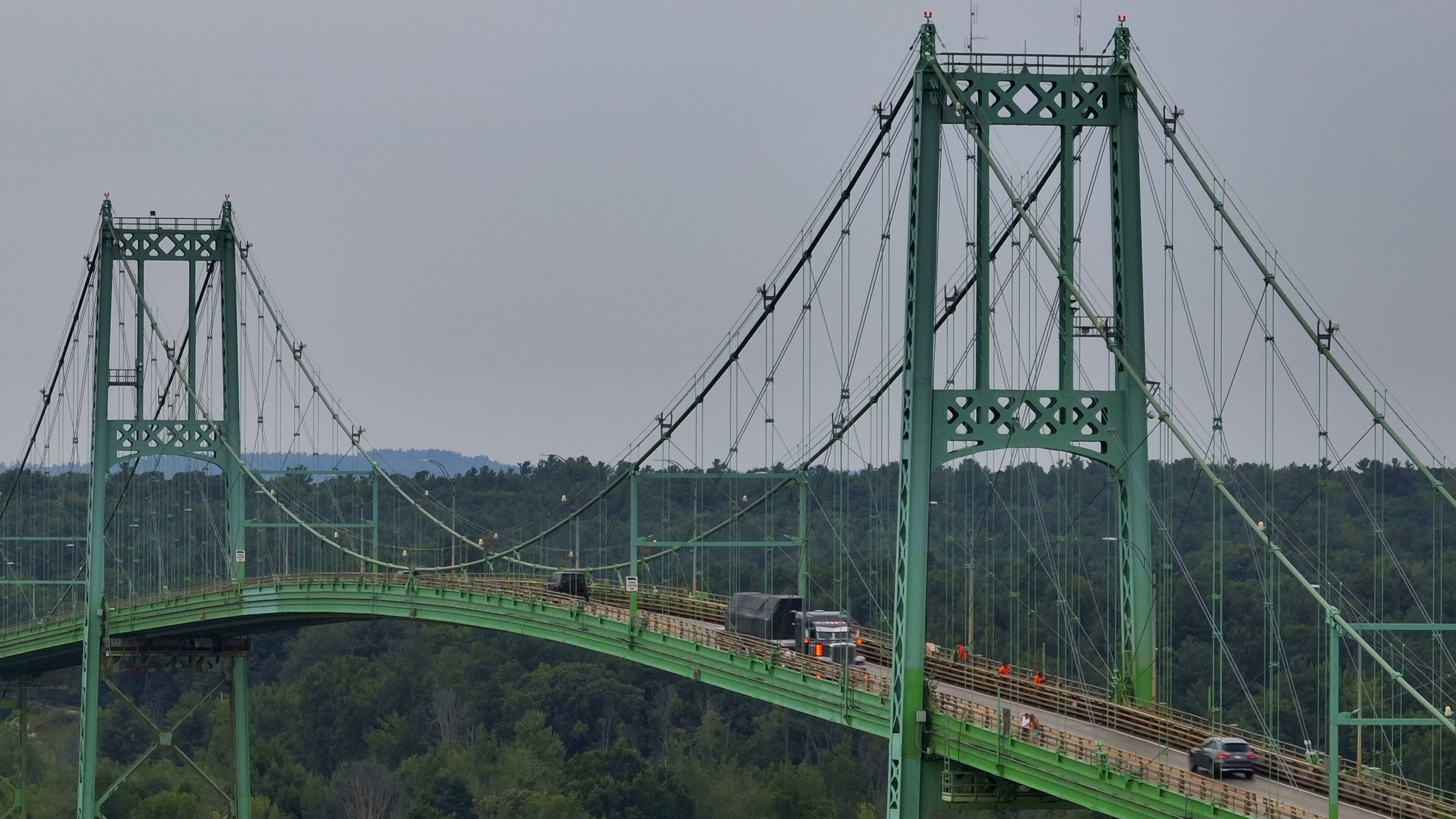 Crossing over Wellesley Island Bridge over St Lawerence River traveling to Thousand Islands for vacation getaway outdoors in New York State
