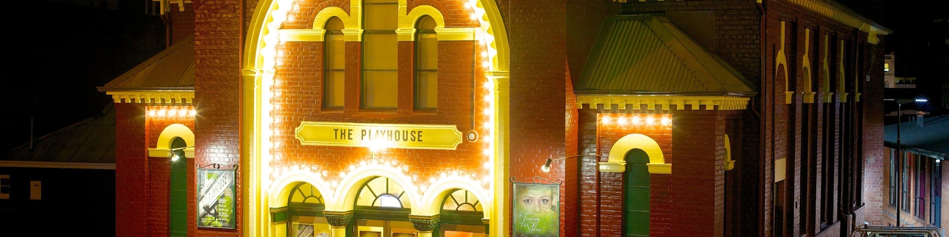 Playhouse Theatre featuring signage, theater scenes and night scenes