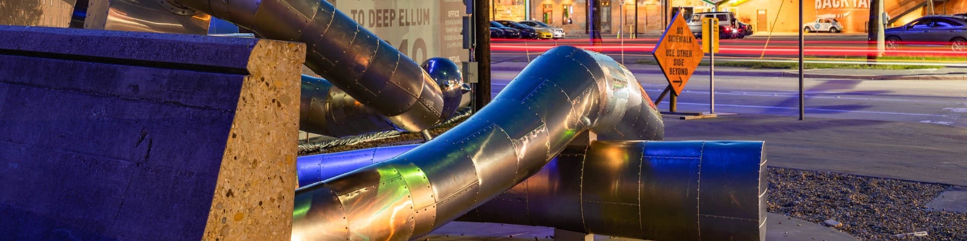 Deep Ellum featuring a city, night scenes and outdoor art
