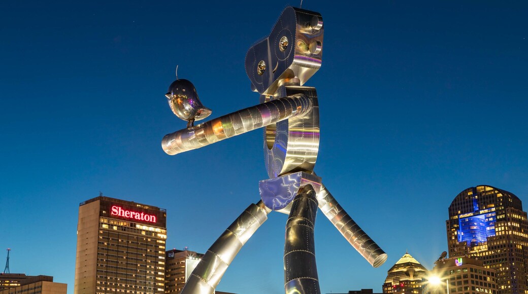 Deep Ellum which includes a city, outdoor art and night scenes