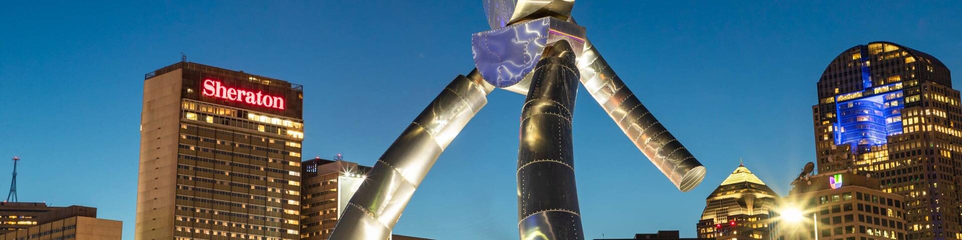 Deep Ellum which includes a city, outdoor art and night scenes