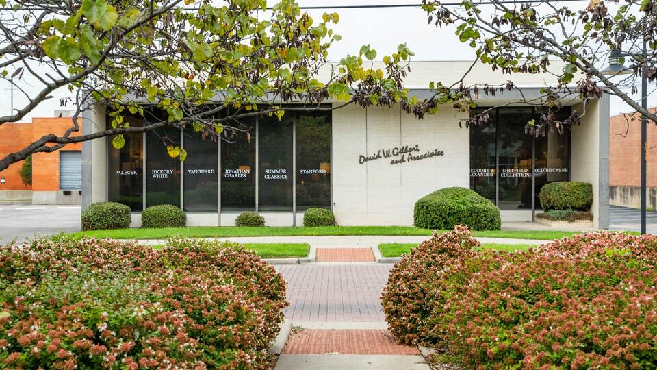 A building with large windows labeled with names like "Palecek" and "Hickory White".