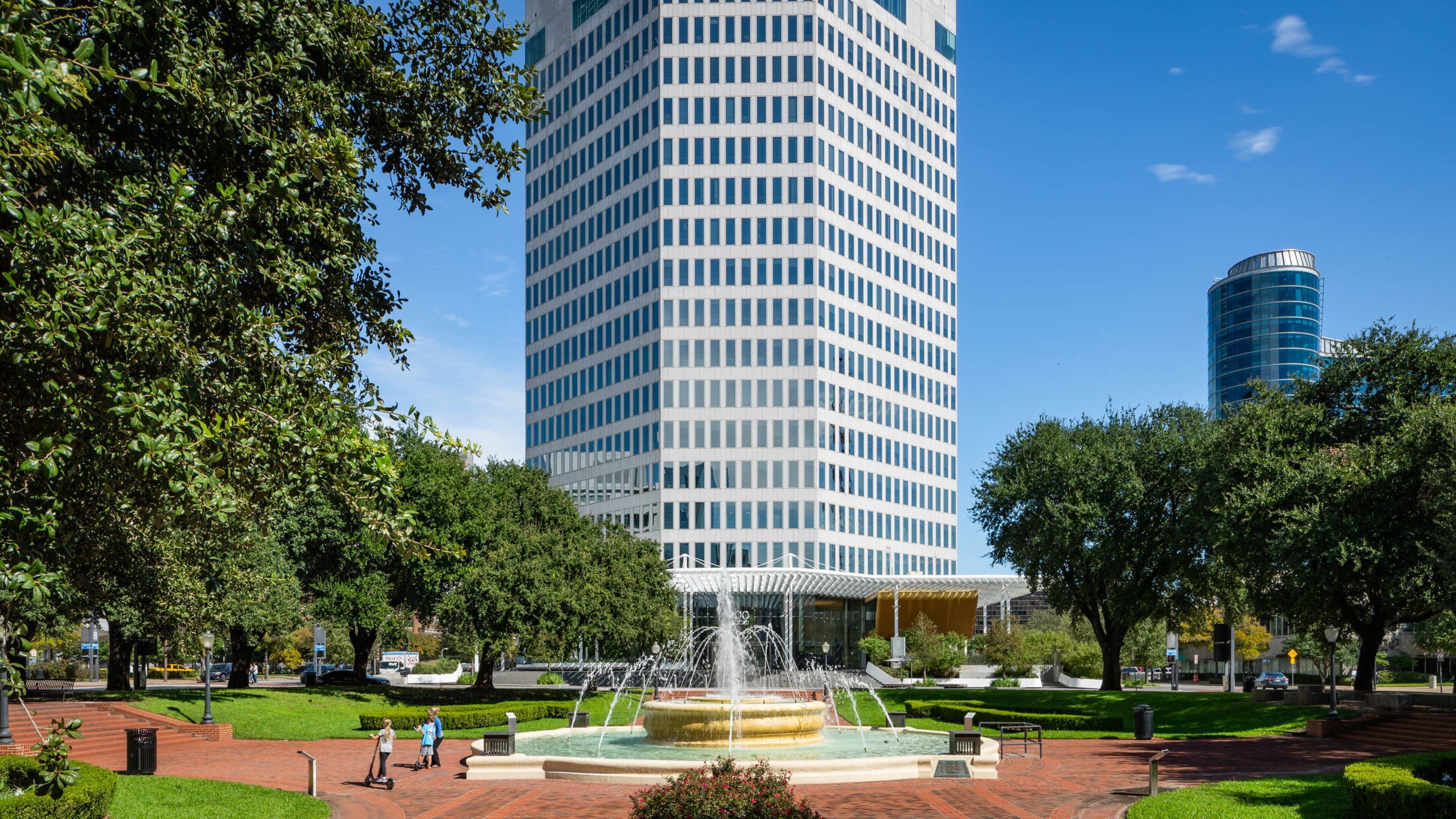 West End Historic District featuring a park, a fountain and a high rise building