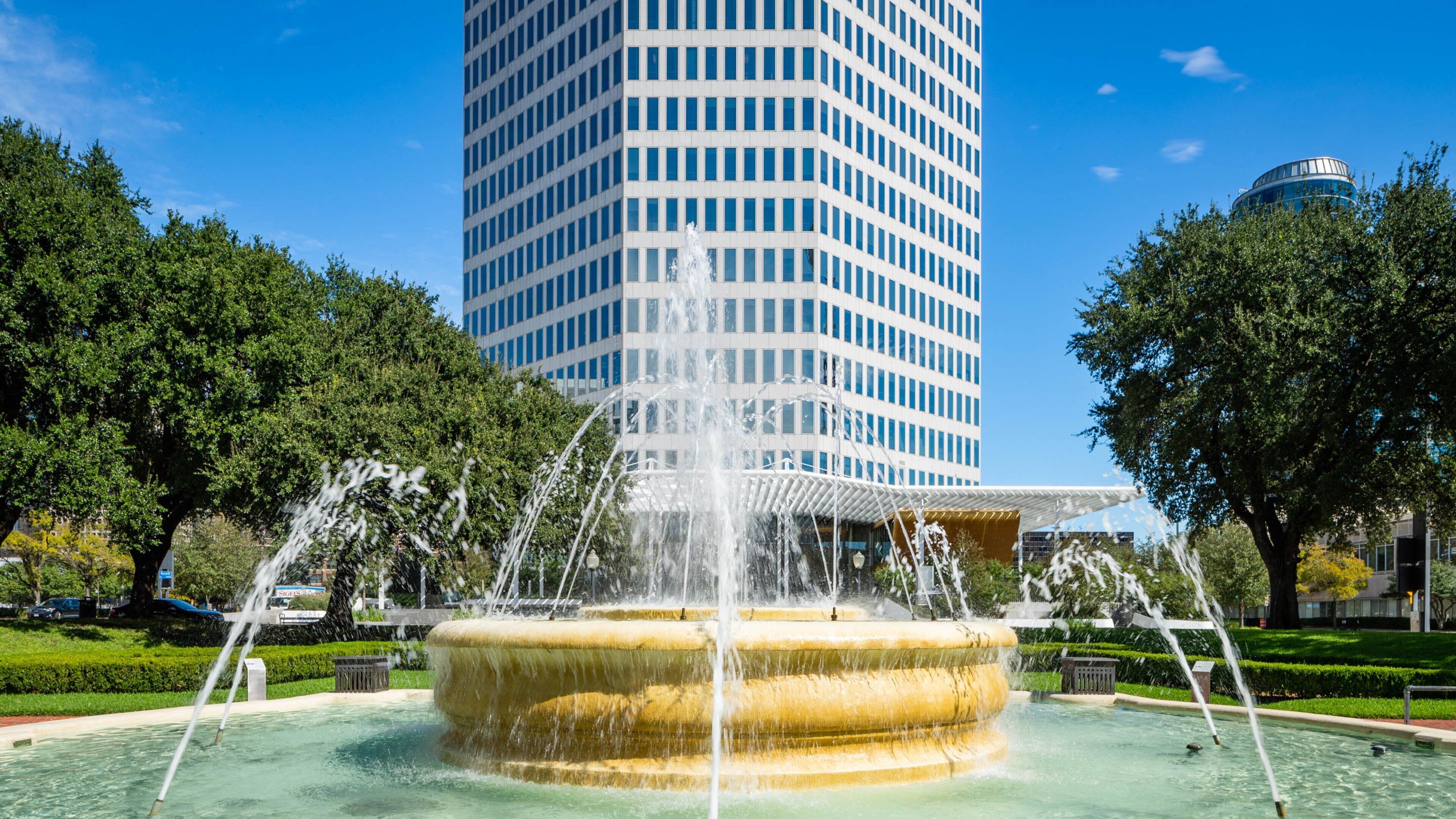 West End Historic District featuring a fountain and a skyscraper