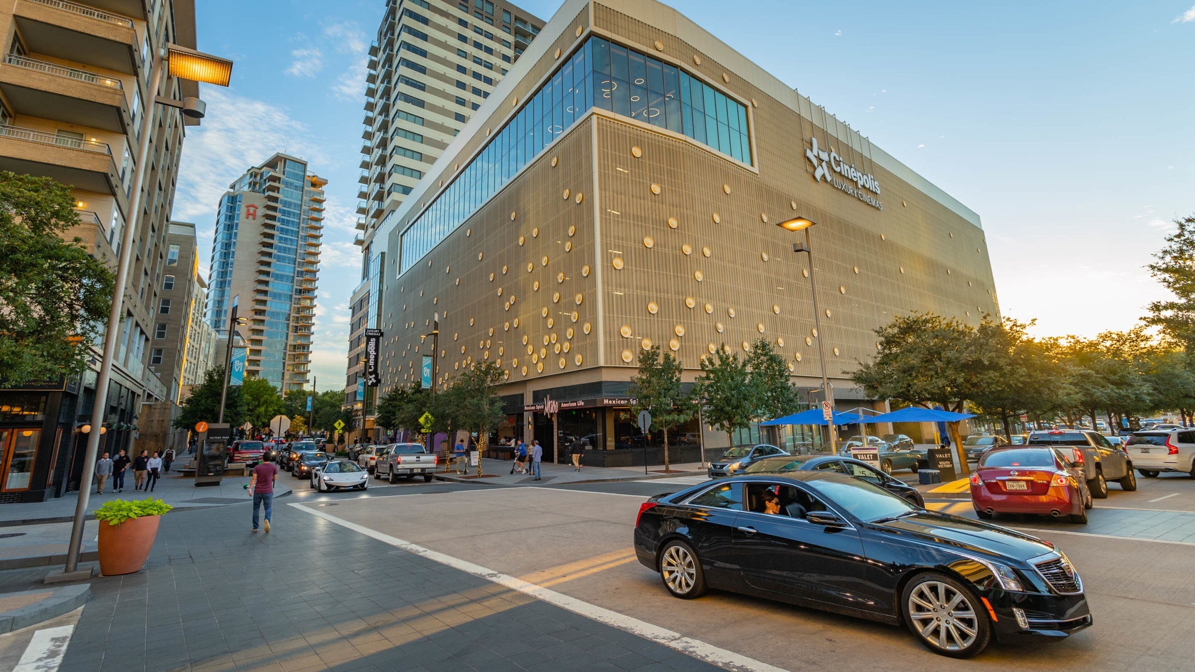 Victory Park showing a sunset, street scenes and a city