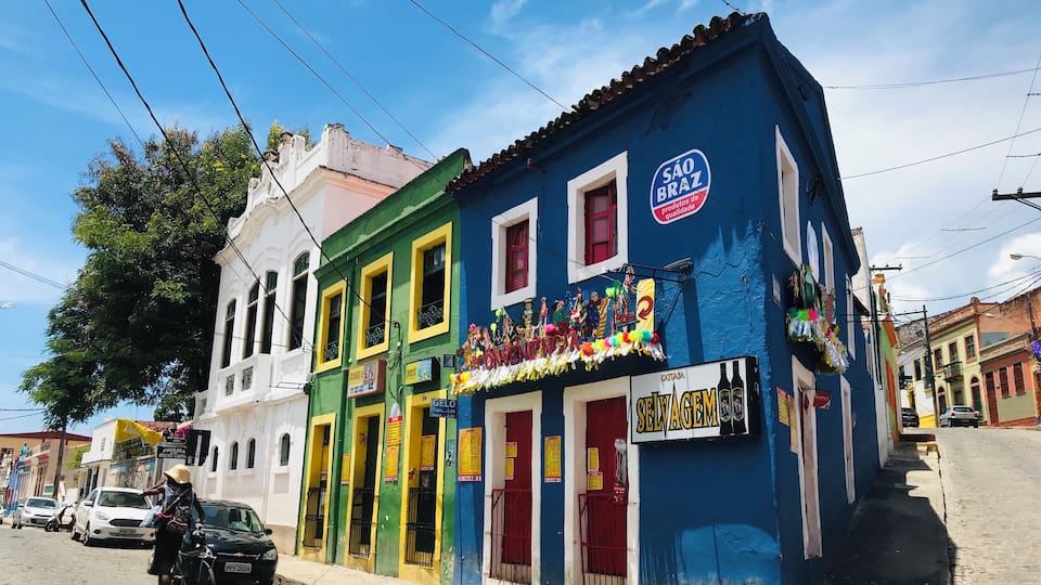 Olinda is a colonial town on Brazilâs northeast coast, near the city of Recife. Founded in 1535 by the Portuguese, itâs built on steep hillsides and distinguished by its 18th-century architecture, baroque churches, convents, monasteries and brightly painted houses. Originally a center for the sugarcane industry, itâs now known as an artistsâ colony, with many galleries, workshops and museums.