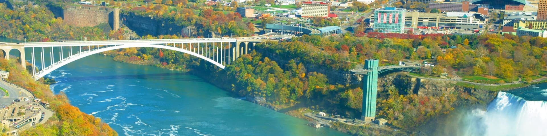 View of Rainbow Bridge connecting USA and Canada near Niagara Falls in autumn