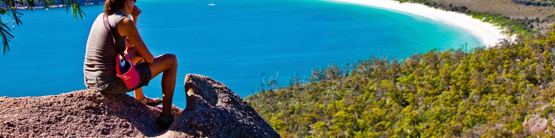 Freycinet showing general coastal views and mountains as well as an individual female