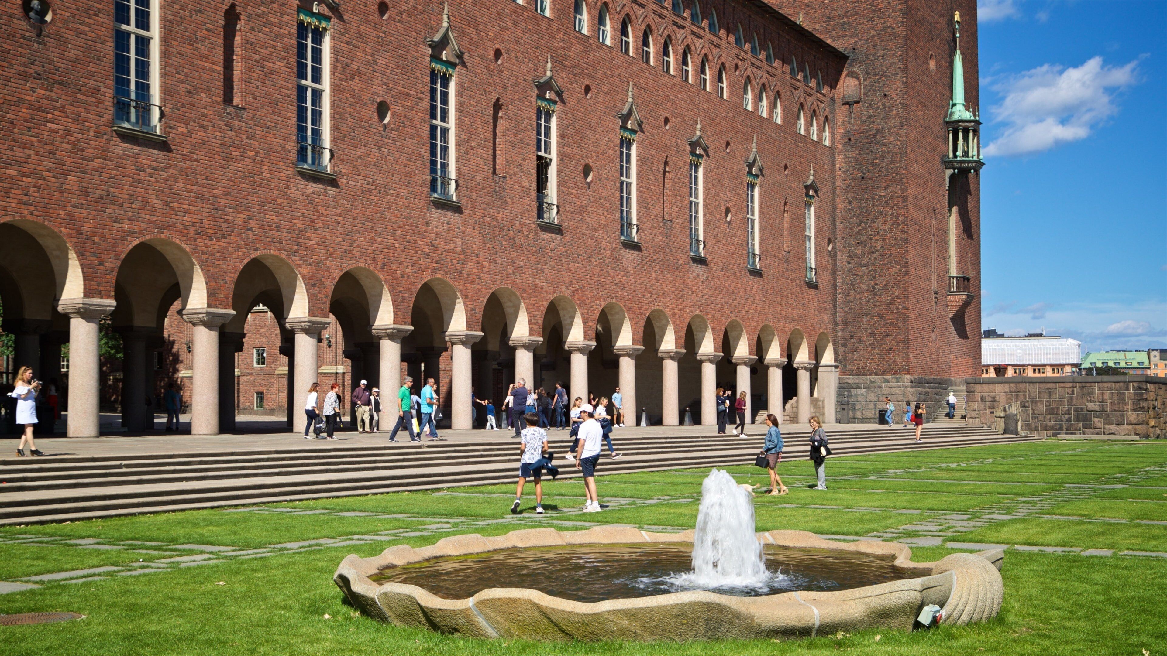 Stockholm City Conference Centre featuring a garden, a fountain and heritage architecture