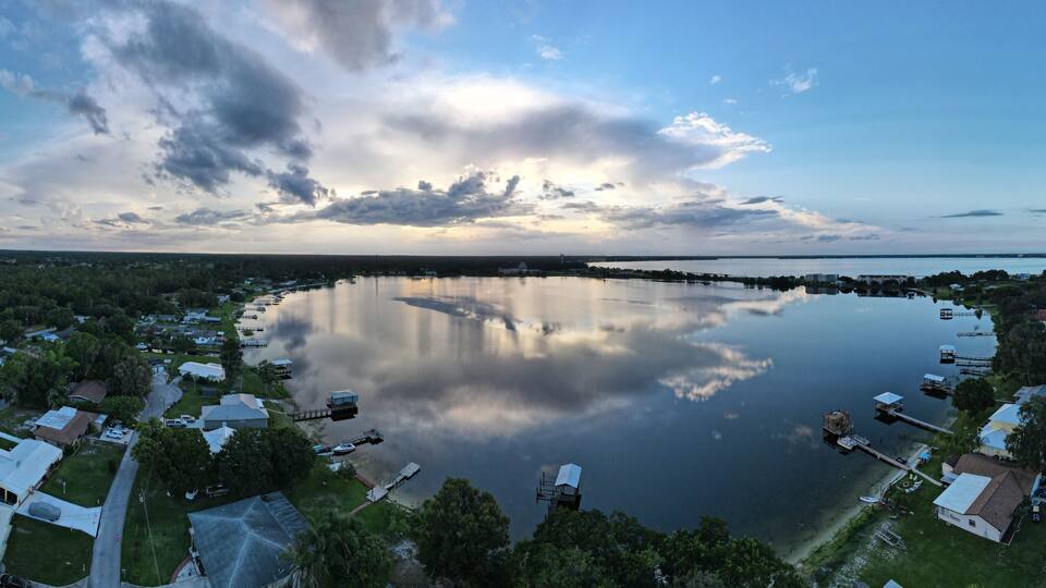A lake surrounded by residential houses and docks.