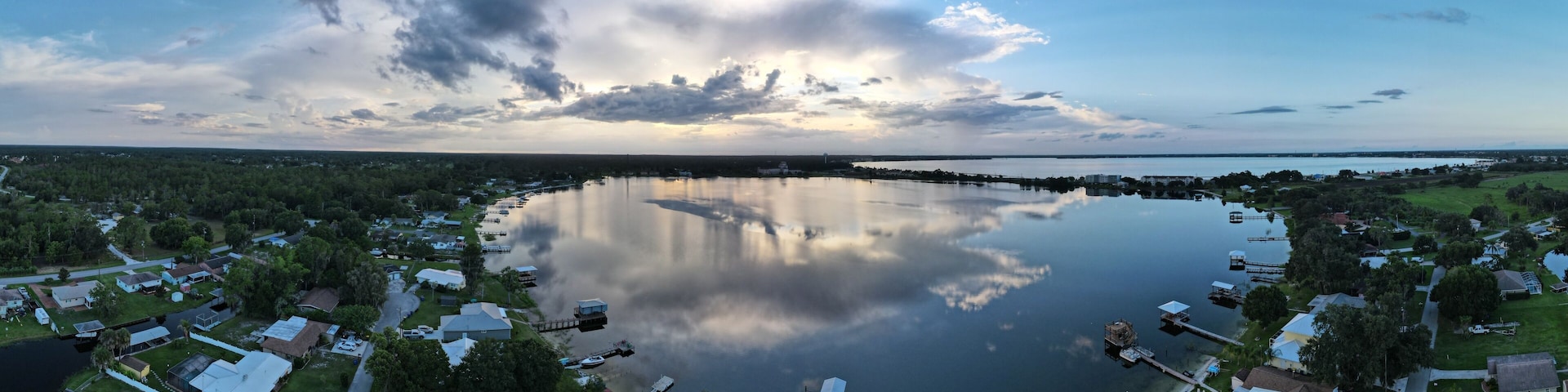 A lake surrounded by residential houses and docks.