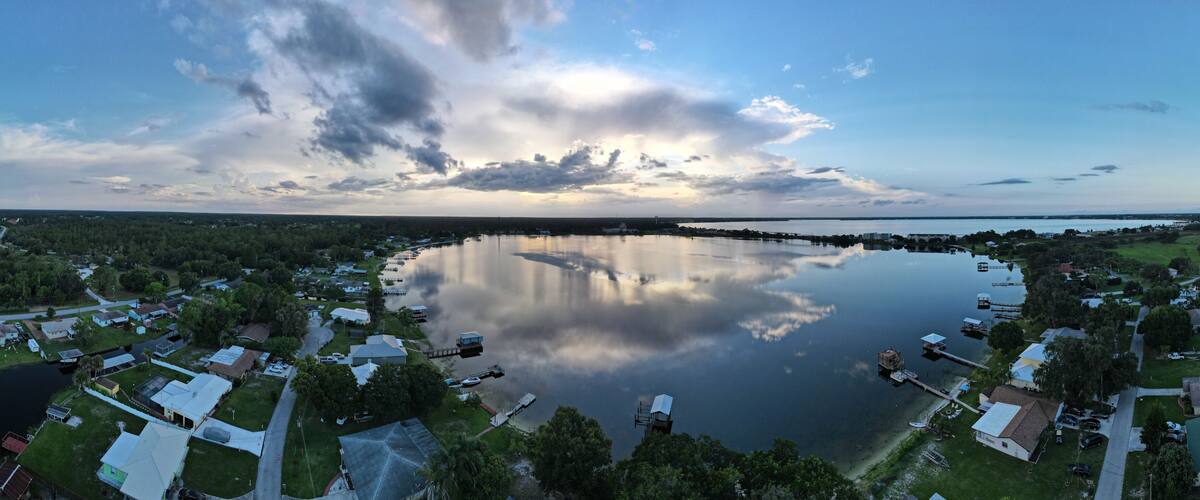 A lake surrounded by residential houses and docks.