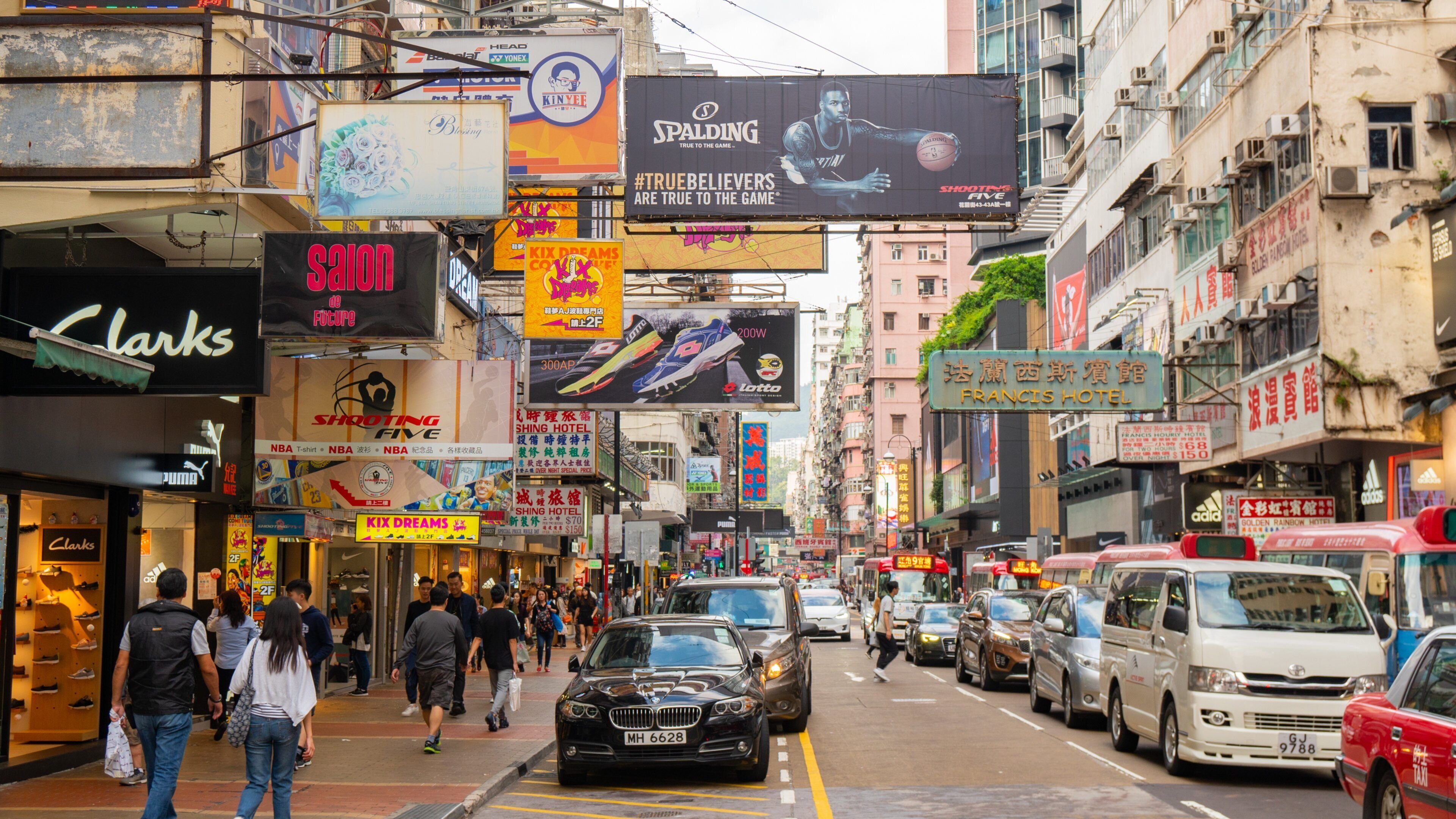 Sneaker Street showing signage, a city and street scenes