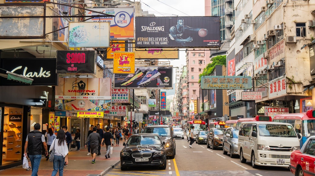 Sneaker Street showing signage, a city and street scenes