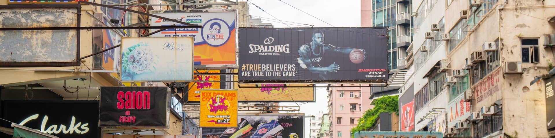 Sneaker Street showing signage, a city and street scenes