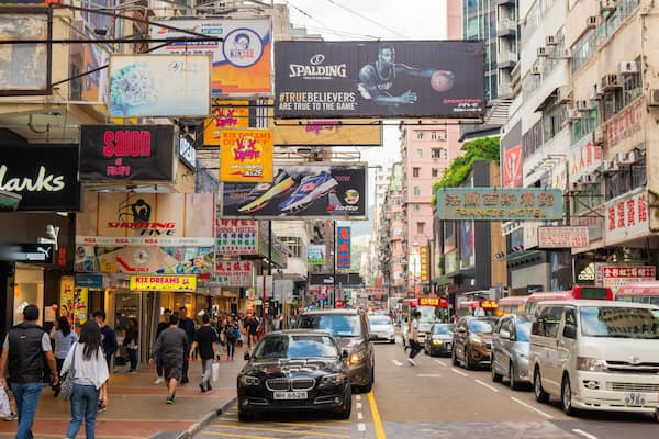 Sneaker Street showing signage, a city and street scenes