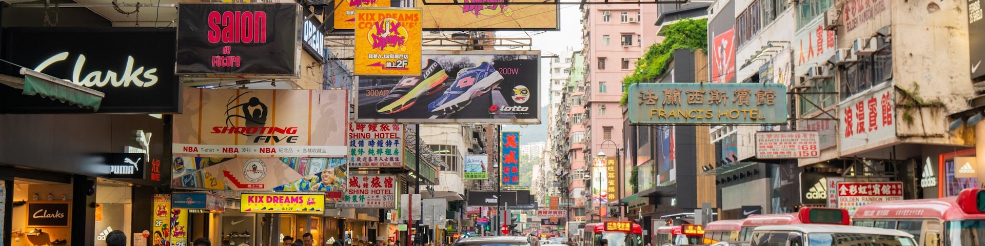 Sneaker Street showing signage, a city and street scenes