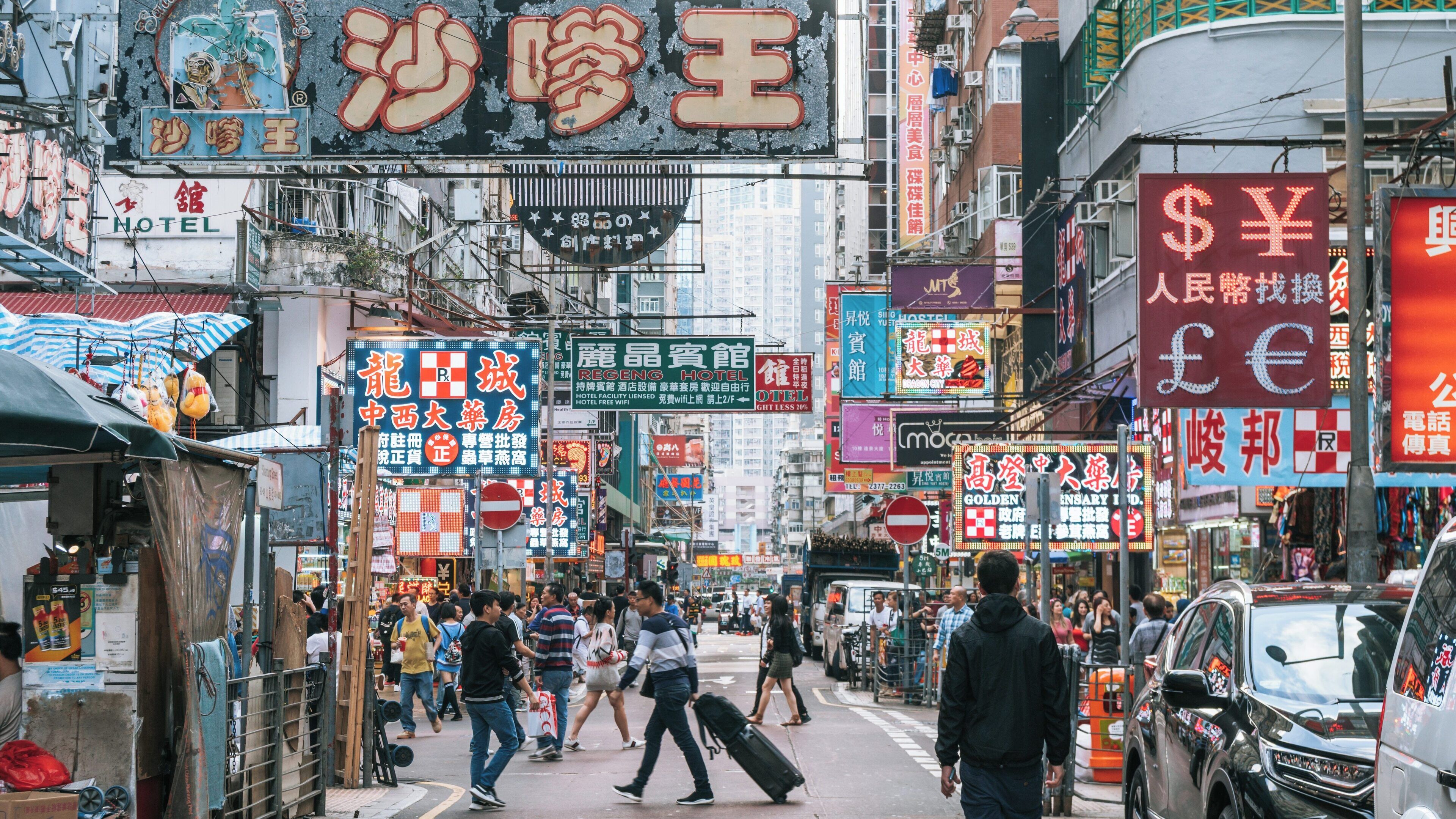 Vibrant street life and signage in Sneaker Street, Mong Kok, Kowloon, Hong Kong SAR showcasing local culture and commerce