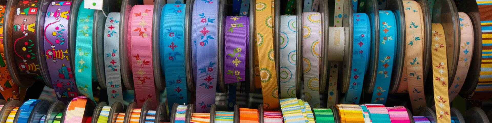 A variety of colorful ribbons displayed in a store.