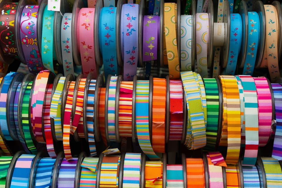 A variety of colorful ribbons displayed in a store.