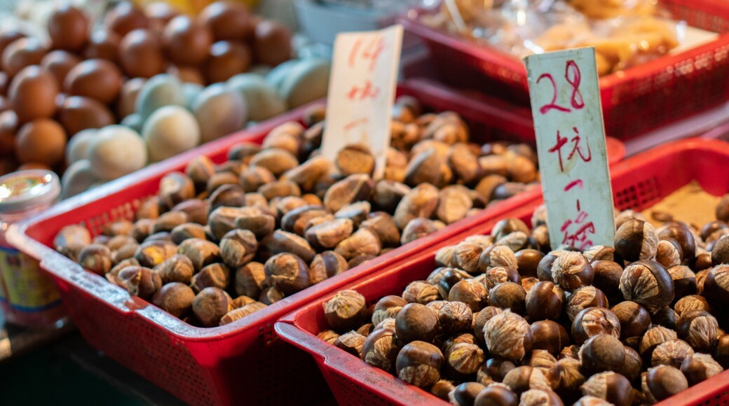 Tai Yuen Street Toy Market featuring signage, markets and food