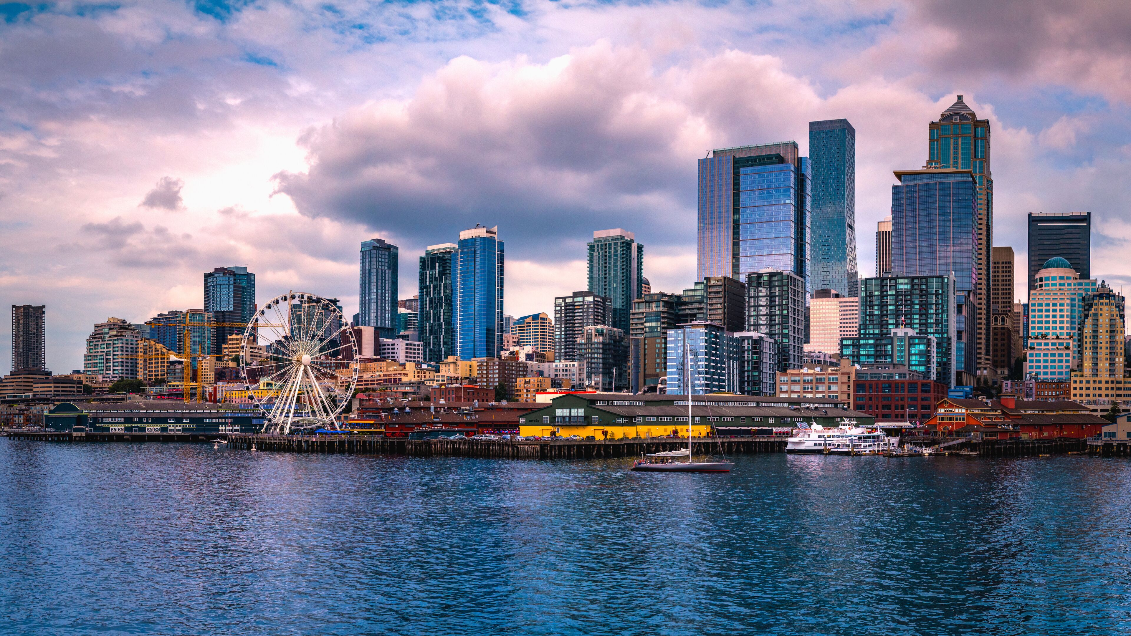 Seattle city skyline with dramatic clouds over Elliot Bay in Washington State, USA