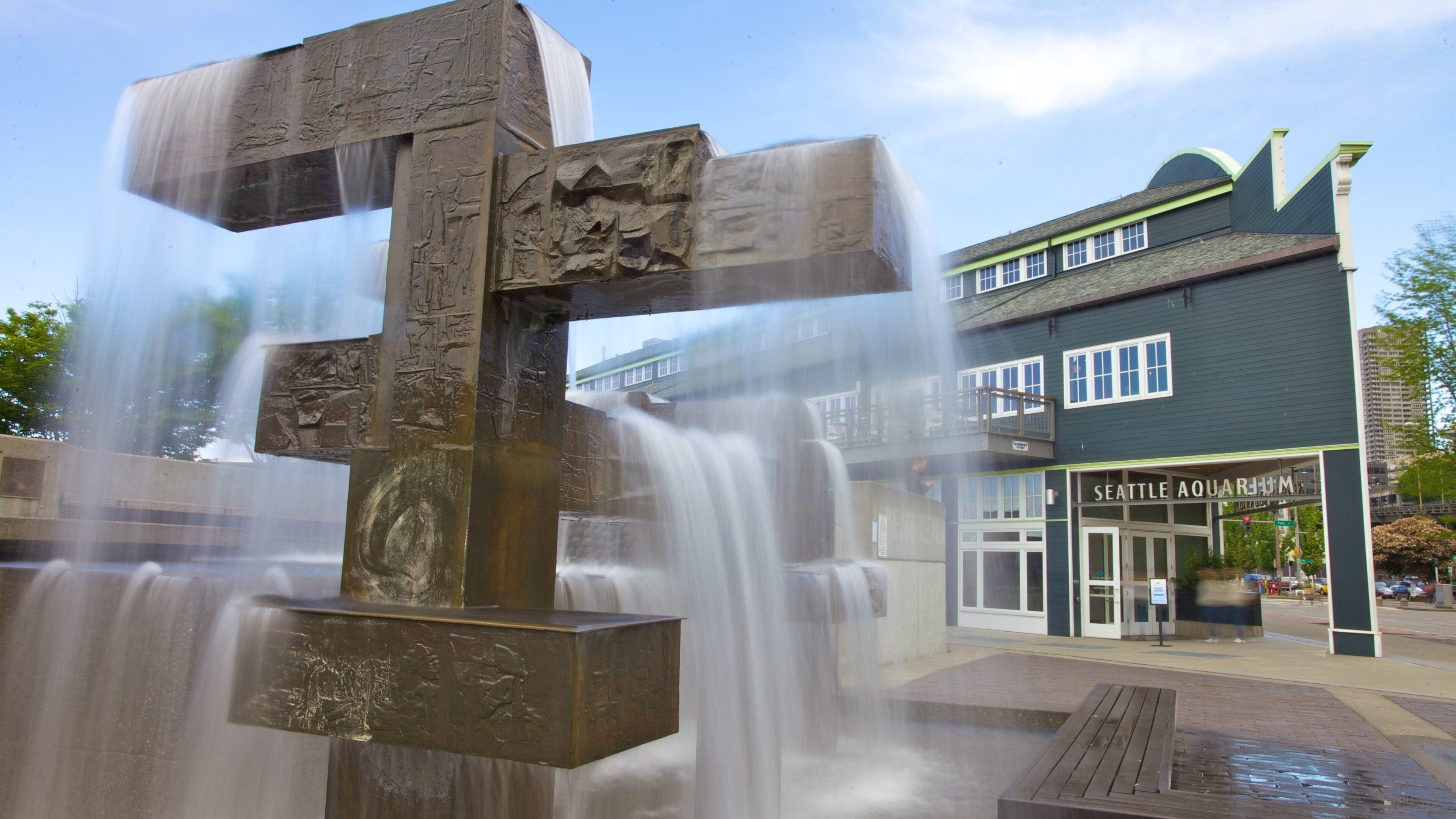 Vibrant Seattle Waterfront with cascading water feature near the Seattle Aquarium