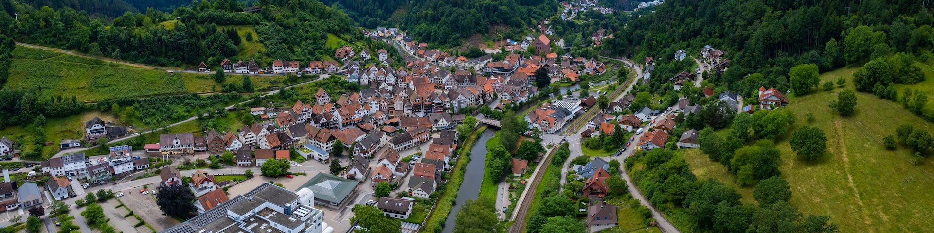 Aerial panoramic view of the city Schiltach in Germany, Baden-Wurttemberg on a sunny spring afternoon.