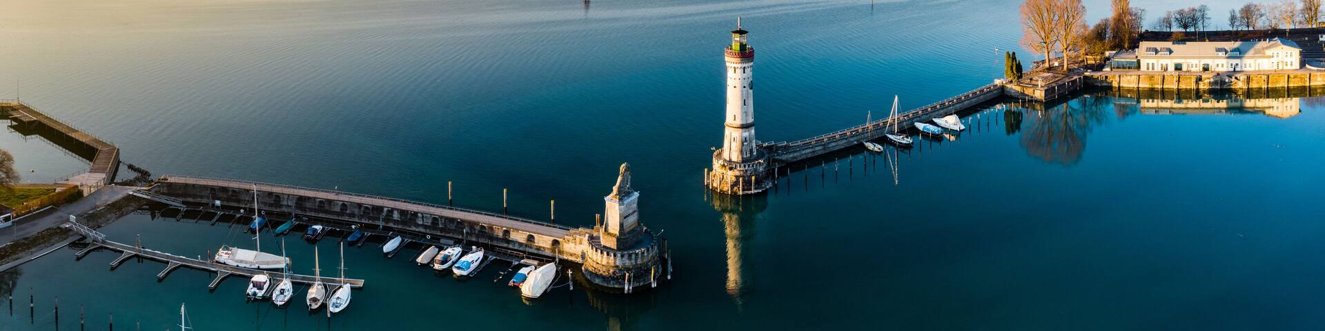 Aerial Panoramic view of Lindau Harbour and the Austrian Alps, Lake Constance