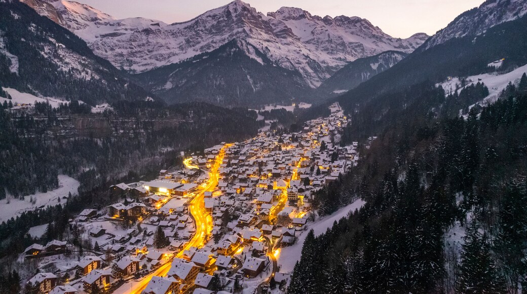 Aerial view of Champery at sunset, a small town on the Alps in wintertime with snow, Valais, Switzerland.
