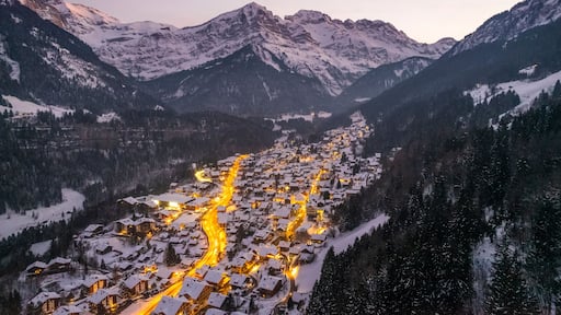 Aerial view of Champery at sunset, a small town on the Alps in wintertime with snow, Valais, Switzerland.